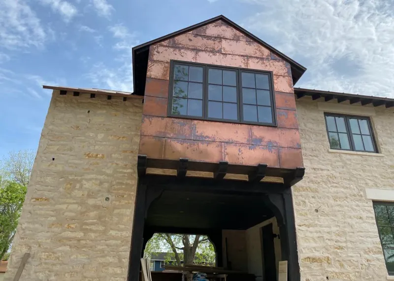 Copper metal panel facade on a stone building for Metal Roof Coating in Tahlequah