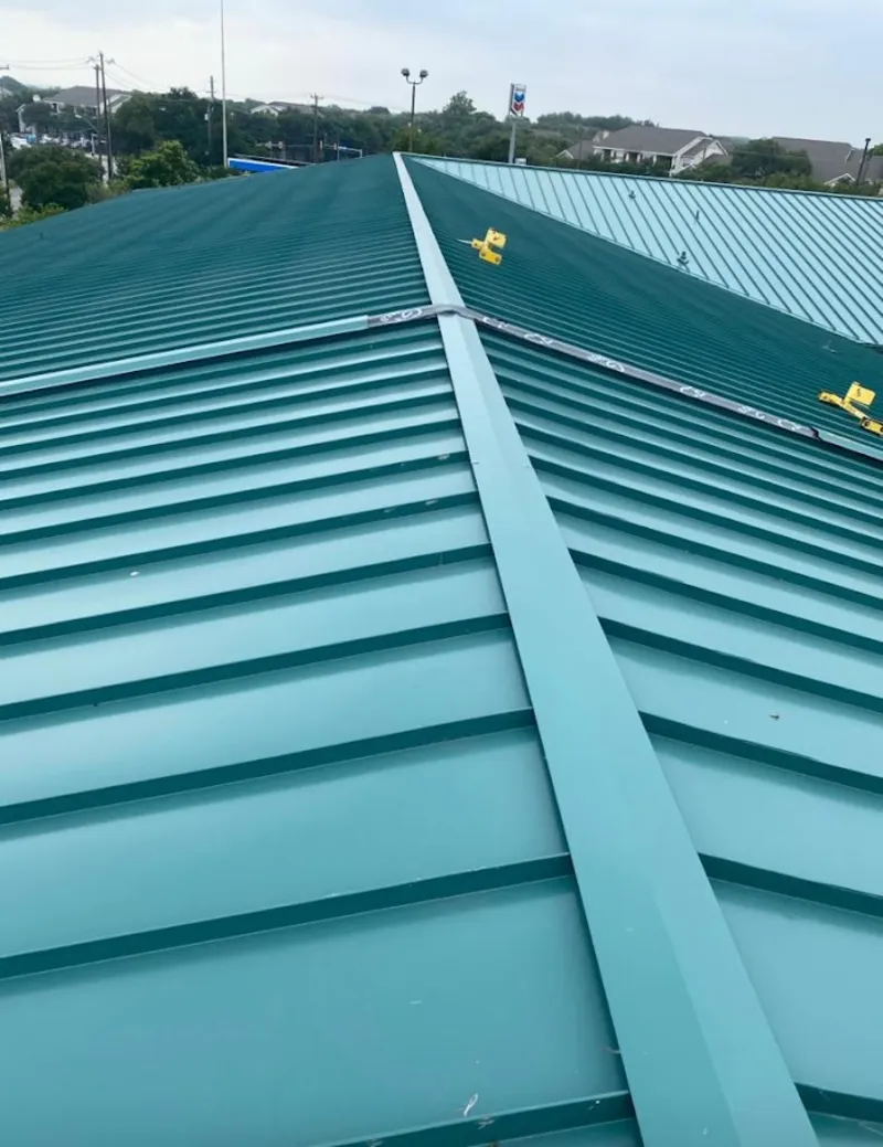 Green commercial metal roof ridge and valley for Metal Roof Repair in Tahlequah